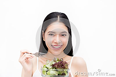 Young Asian beautiful smiling slim woman eating vegetable salad - healthy and diet eating lifestyle concept Stock Photo