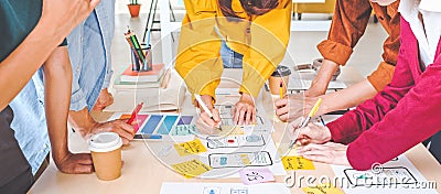 Young Asian business creative team work together, mobile application software design project. Brainstorm meeting concept Stock Photo