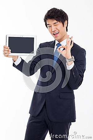 Young Asian business man showing a pad PC Stock Photo