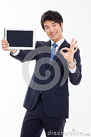 Young Asian business man showing a pad PC Stock Photo