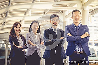 The young Asian business team stands with confidence and pride. Stock Photo