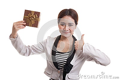 Young Asian business woman thumbs up with a gift box. Stock Photo