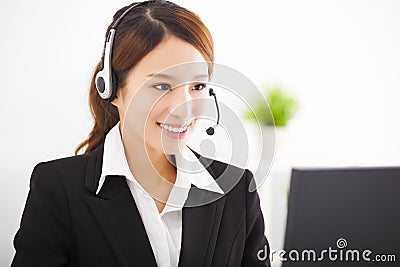 Young asian businesswoman with headset in office Stock Photo