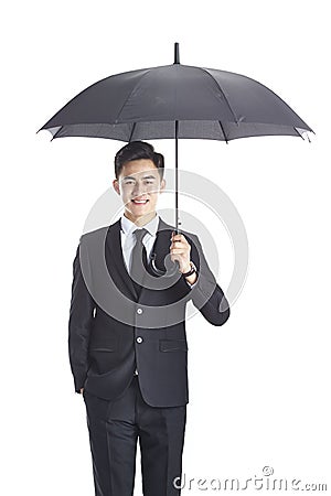 Young asian corporate executive holding a black umbrella Stock Photo