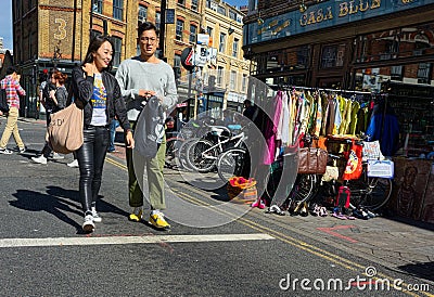 Young Asian couple shopping in Brick Lane, East London, UK Editorial Stock Photo