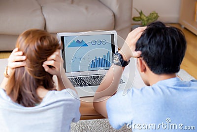 Young asian couple stressed and worried about finance of problem business together, man and woman looking laptop and frustrated Editorial Stock Photo