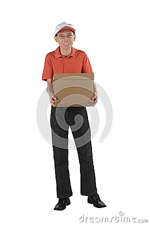 Young asian courier holding a cardboard box while standing Stock Photo