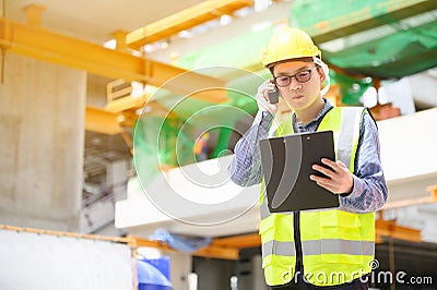Young asian engineers are working on the construction site Stock Photo