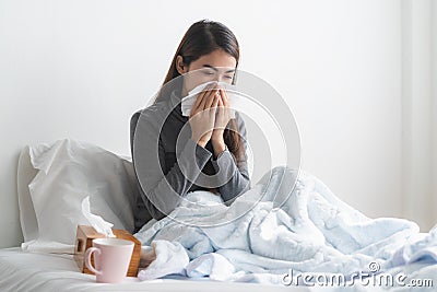 Young girl have running nose and sick in the bedroom Stock Photo