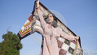 Young asian girl standinf at field grass and blue sky Stock Photo