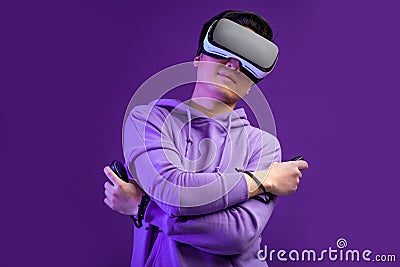 Chinese man using the virtual reality headset gesturing with hands isolated Stock Photo