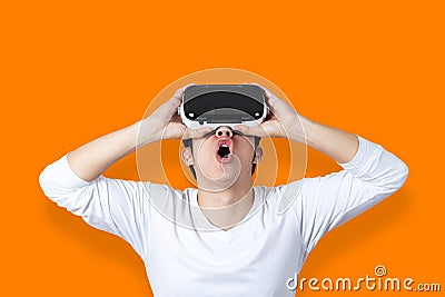 Young Asian Man Amazed By Virtual Reality Stock Photo