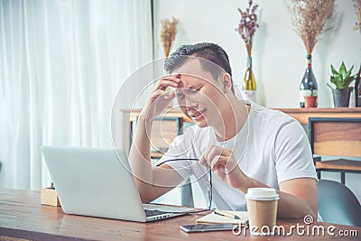 Man sitting on chair and crying because his work is fail Stock Photo