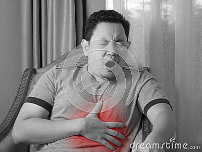 Young Man Having Chest Pain Stock Photo