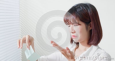 Woman use oil blotting paper Stock Photo