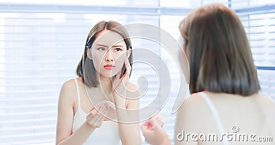 Woman use oil blotting paper Stock Photo