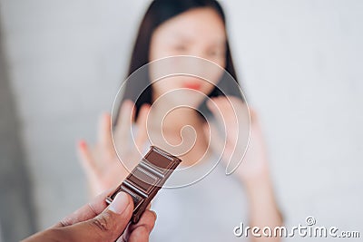 Young Asian Woman Acne Problem Face with Chocolate Stock Photo