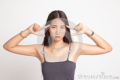 Young Asian woman block both ears with fingers Stock Photo