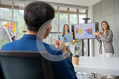Young asian woman entrepreneur startup presenting with financial backers for new project to request funding to support the project Stock Photo