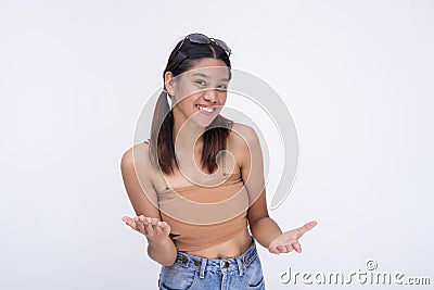 A young asian woman gives an explanation, discussing with eagerness. Isolated on a white background Stock Photo