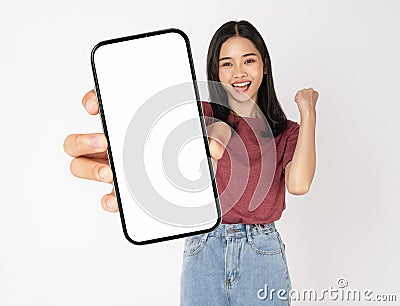 Young Asian woman holding smartphone with blank screen for advertise on white background Stock Photo