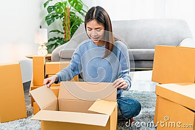 Young Asian woman pack the product and send to the customer. Stock Photo