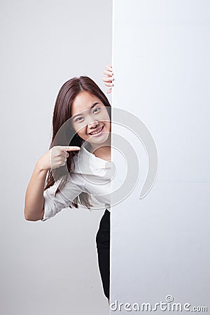 Young Asian woman point to a blank sign. Stock Photo