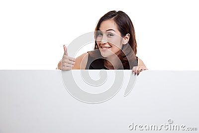 Young Asian woman show thumbs up with blank sign. Stock Photo