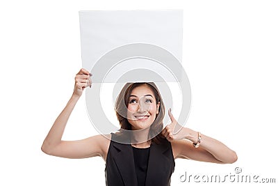 Young Asian woman show thumbs up with white blank sign. Stock Photo