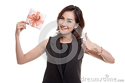 Young Asian woman thumbs up with a gift box. Stock Photo