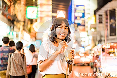 Young Asian Woman Traveler with view at China Town in Bangkok, Thailand Editorial Stock Photo