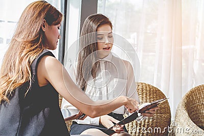 Young Asian. women Business people meeting point to discuss, plan. Trading of economic cosmetics. Stock Photo