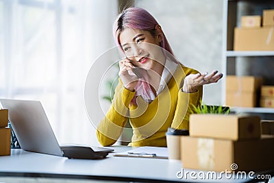 young asian women contacted a customer asking for a shipping address Stock Photo