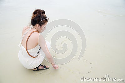 Young asian women sitting on beach Stock Photo