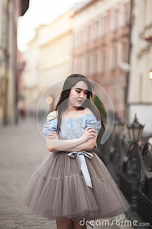 Young Asians girl with modern dress posing in an old Krakow Stock Photo