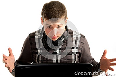 Young astonished businessman working on a laptop Stock Photo