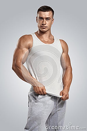 Young athlete wearing blank white vest, sleeveless t-shirt Stock Photo