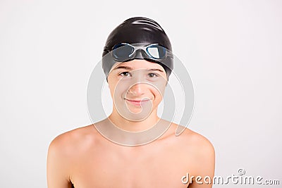 Young athletic healthy teenager ready to swim with swimming goggles and cap Stock Photo