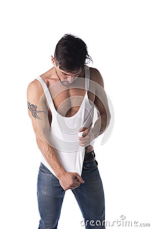 Young athletic man pulling down tanktop Stock Photo