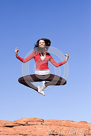 Young athletic woman jumping Stock Photo