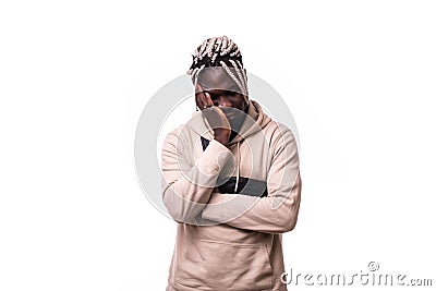 Young attractive afro american man looking sad and depressed posing emotional in sadness face expression isolated on white Stock Photo