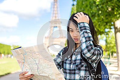 Young attractive asian tourist lost in Paris Stock Photo