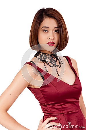 Young attractive asian woman with red lips and jewelry isolated Stock Photo