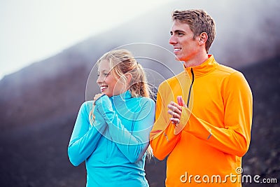 Young attractive athletic couple, wearing sporty cloths on trail Stock Photo