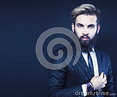 young attractive bearded hipster man gesturing emotional screaming in studio sucsess. fashion modern brutal guy Stock Photo