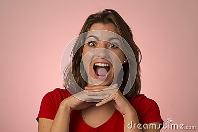 Young attractive and beautiful woman smiling excited and happy in nice shock and surprise Stock Photo