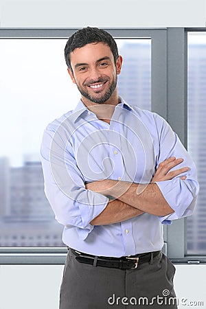 Young attractive business man standing in corporate portrait Stock Photo