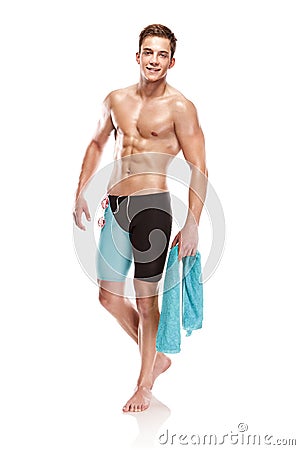 Young attractive caucasian man swimmer with goggles and towel Stock Photo