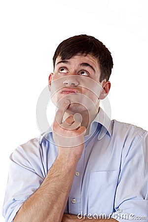 Young attractive contemplative man looks up Stock Photo