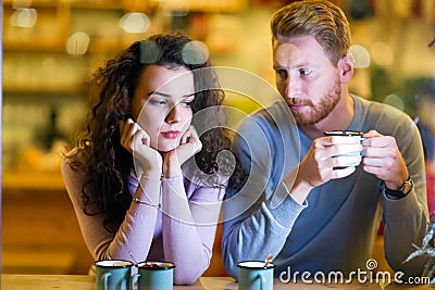 Young attractive couple having problems on date Stock Photo